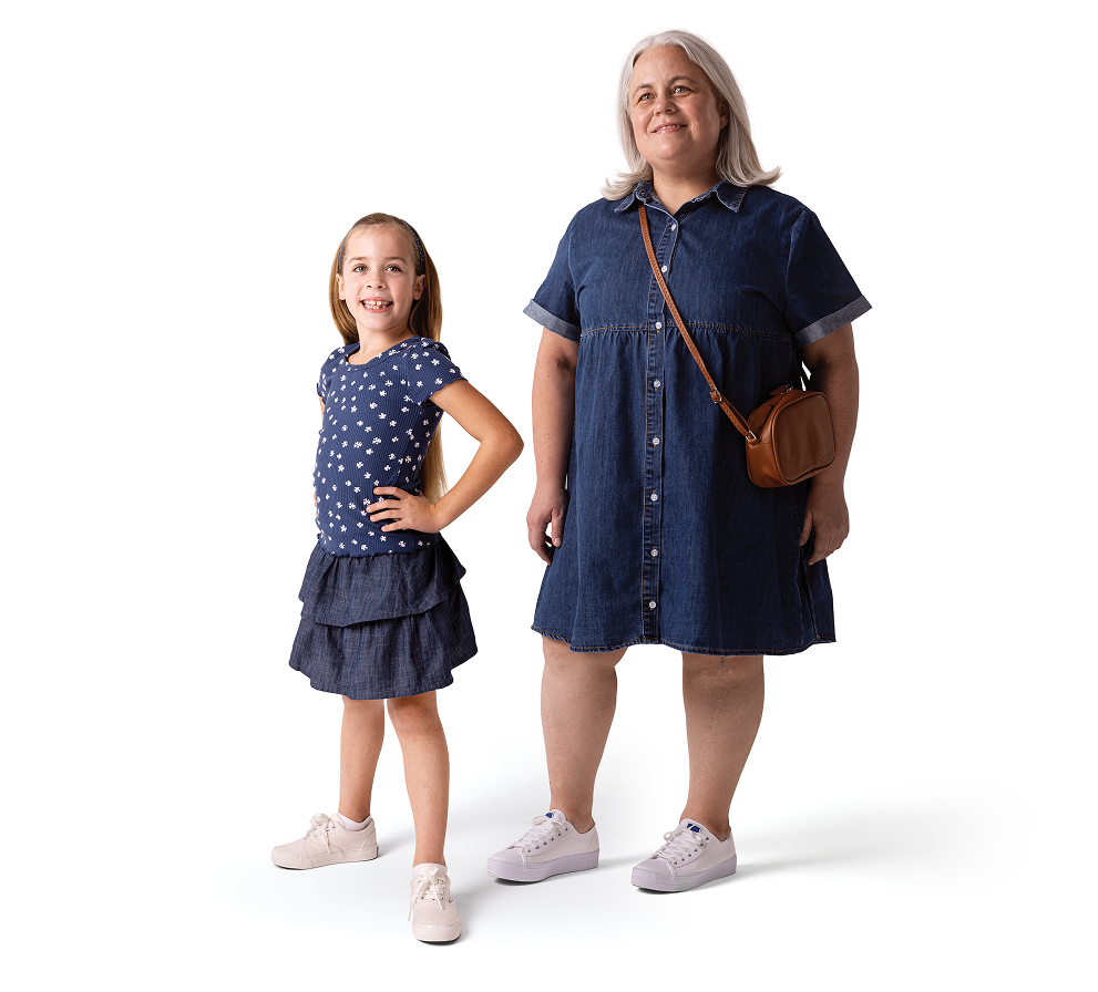 A woman and a young girl standing together